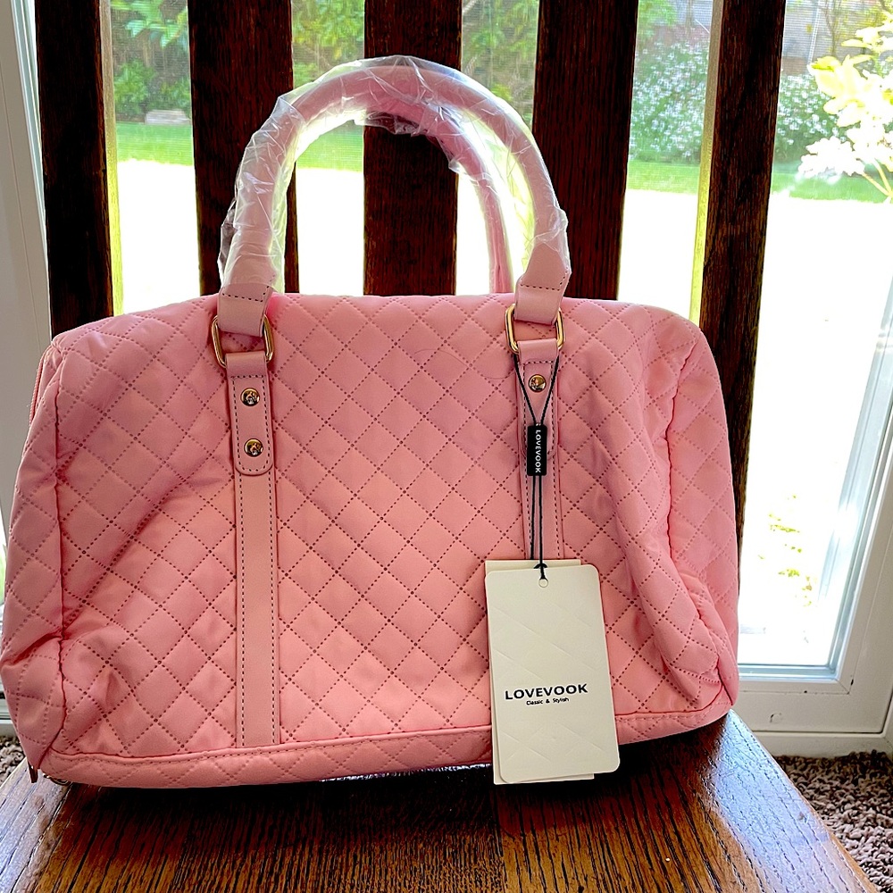 Brand new, never used Lovevook toiletry bag.